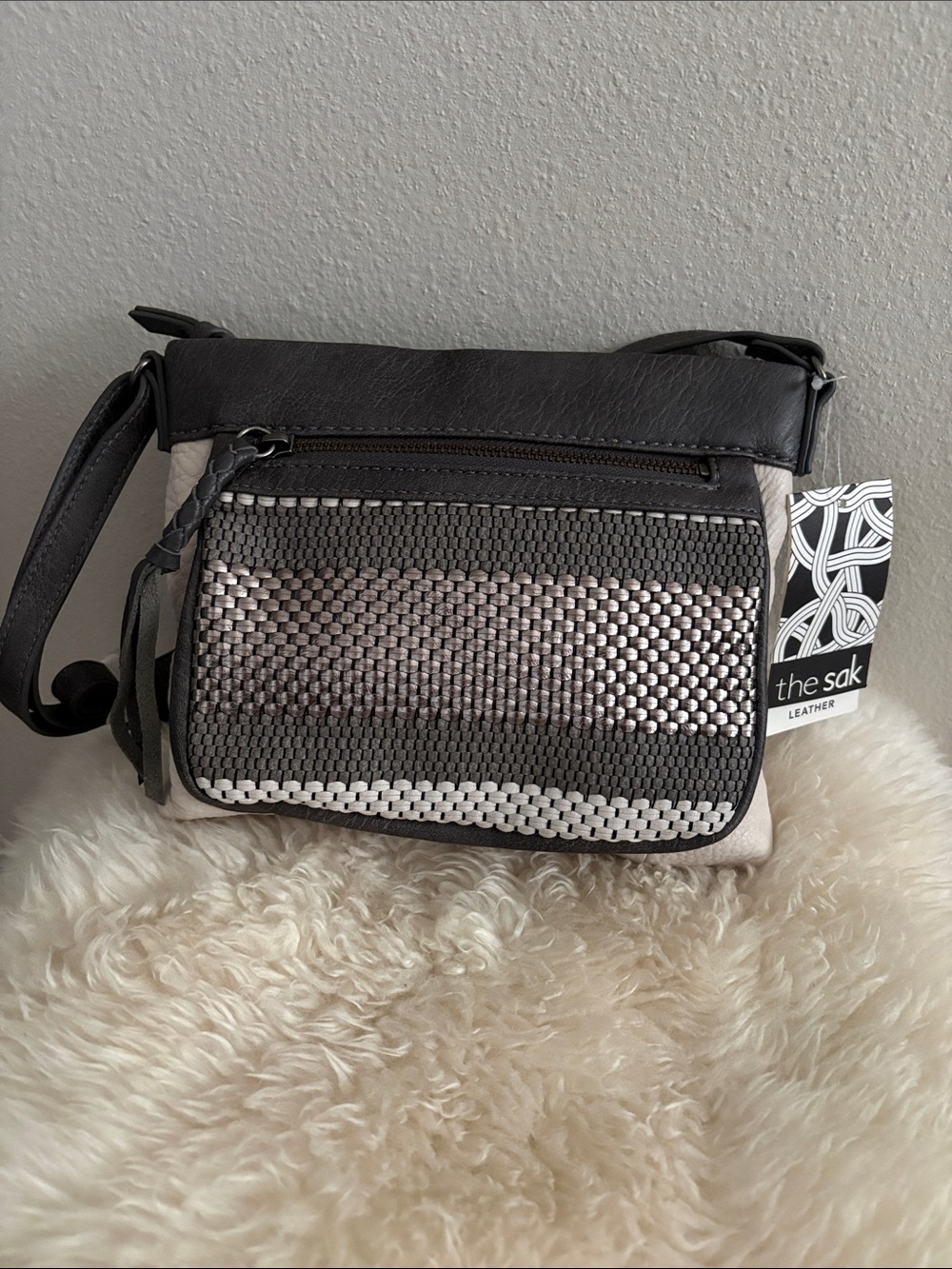 The Sak Leather Messenger Bag in Black and Cream Woven Front